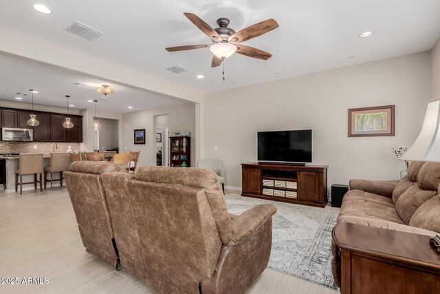 20603 W Alsap Rd, Buckeye, AZ 85396 - living area featuring a ceiling fan and recessed lighting