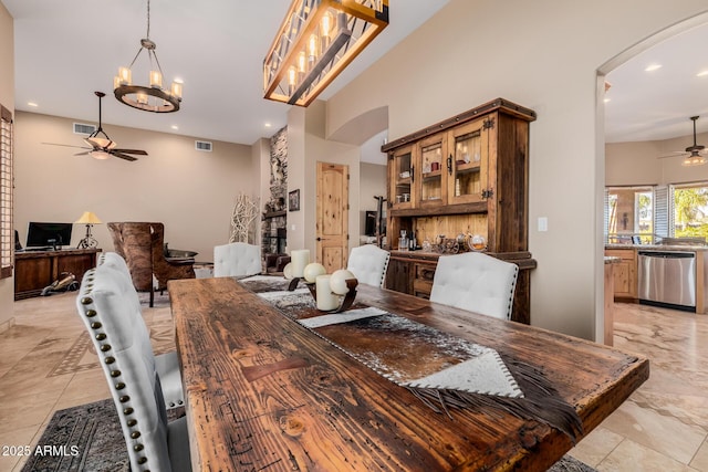 38106 N 2nd Ln, Phoenix, AZ 85086 - dining area with arched walkways, a ceiling fan, a chandelier, and recessed lighting