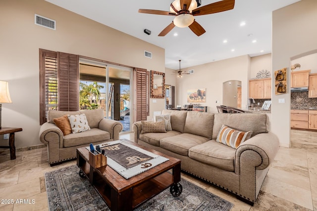 38106 N 2nd Ln, Phoenix, AZ 85086 - living area with ceiling fan, a high ceiling, arched walkways, recessed lighting, and stone tile floors