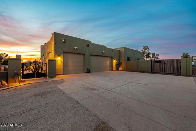 38106 N 2nd Ln, Phoenix, AZ 85086 - view of front of home featuring a gate, driveway, stucco siding, and a garage