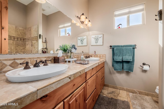 38106 N 2nd Ln, Phoenix, AZ 85086 - bathroom with double vanity and stone tile floors