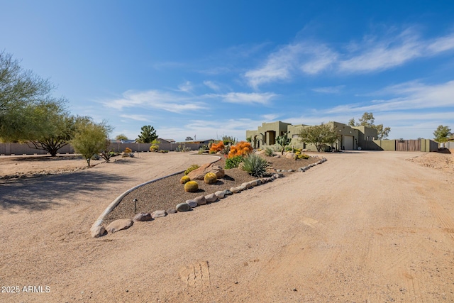 38106 N 2nd Ln, Phoenix, AZ 85086 - adobe home featuring a garage and dirt driveway