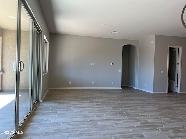 spare room featuring light wood-type flooring