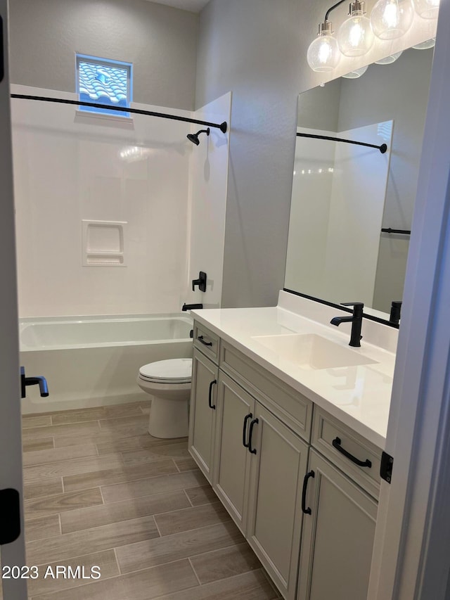 full bathroom with vanity, bathing tub / shower combination, and toilet