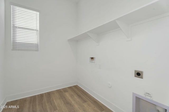 washroom featuring baseboards, laundry area, hookup for a washing machine, wood finished floors, and hookup for an electric dryer