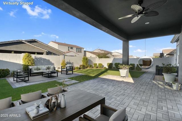 view of patio / terrace with ceiling fan, outdoor lounge area, and a fenced backyard