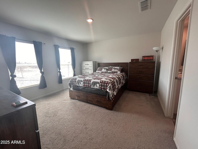 bedroom featuring carpet, visible vents, and baseboards