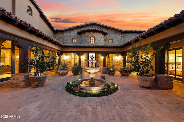 view of patio terrace at dusk