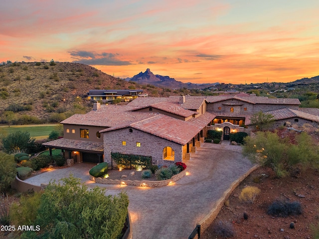 view of front of home featuring a mountain view and a garage