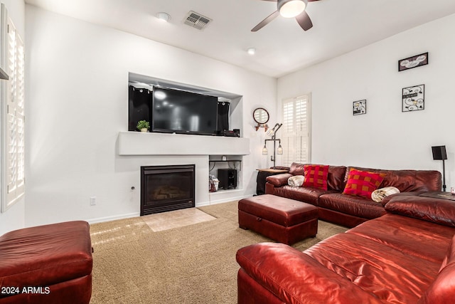 living room featuring carpet floors and ceiling fan