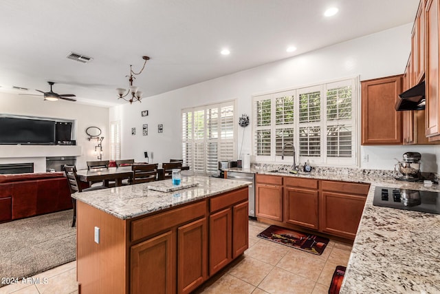 kitchen featuring sink, stainless steel dishwasher, extractor fan, black electric stovetop, and a kitchen island