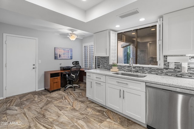 interior space featuring vanity, ceiling fan, and decorative backsplash