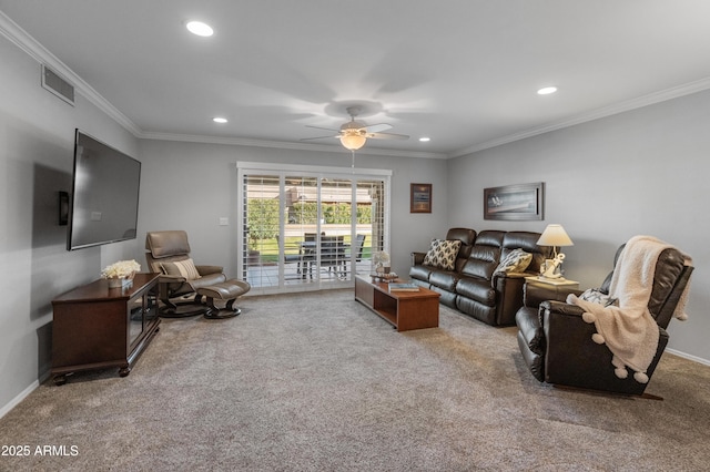 carpeted living room featuring ornamental molding and ceiling fan