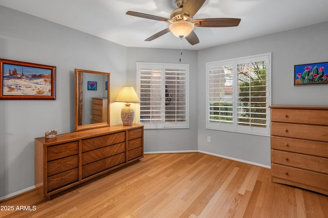 bedroom with light hardwood / wood-style flooring and ceiling fan