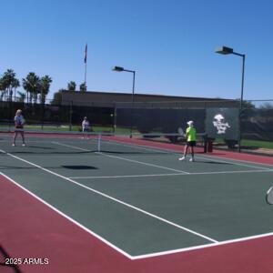 view of tennis court featuring basketball court