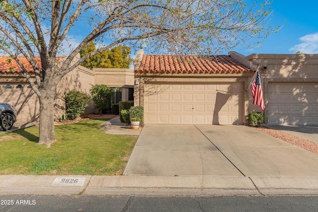 view of front of home featuring a garage and a front yard