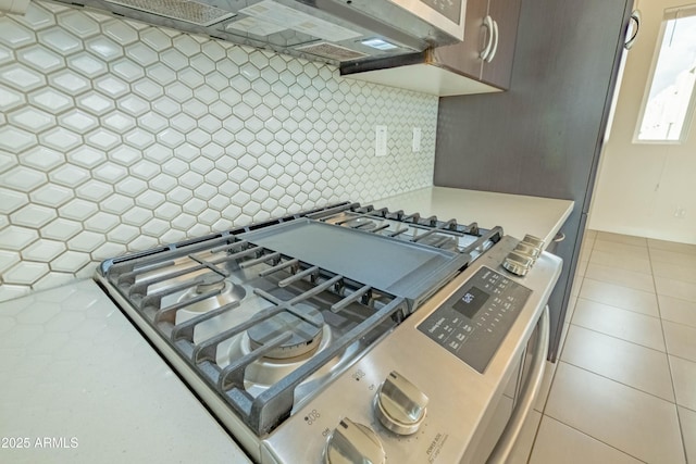 kitchen featuring tasteful backsplash and stainless steel gas stove