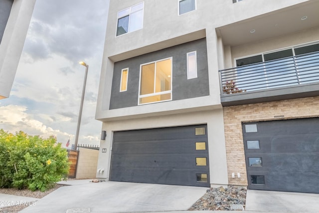 exterior space with a balcony and a garage