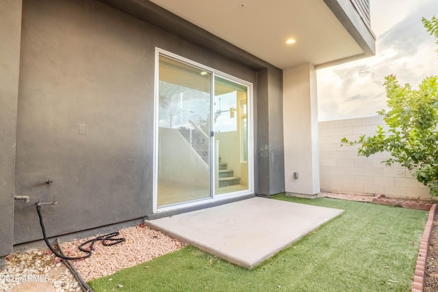 property entrance featuring a patio