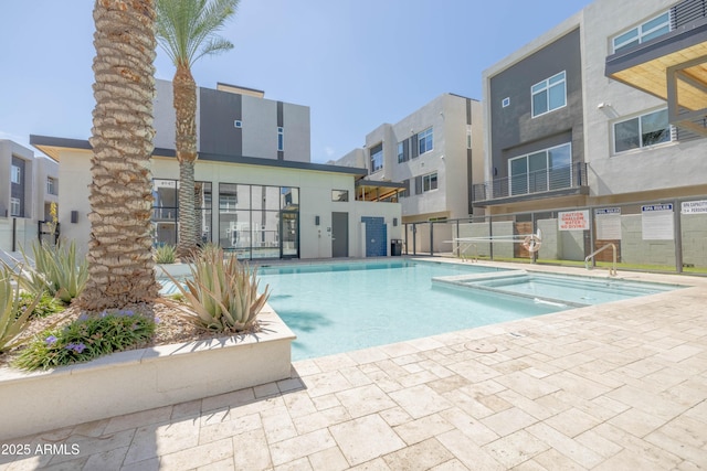 view of pool with a community hot tub