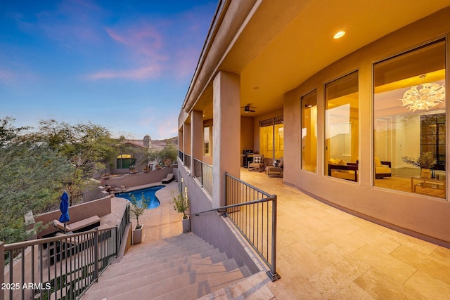 view of patio terrace at dusk