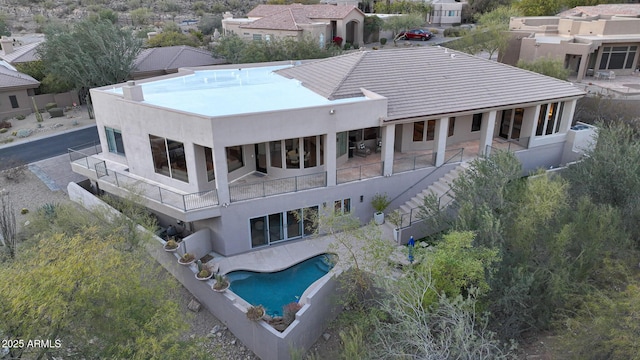 rear view of property featuring a patio area