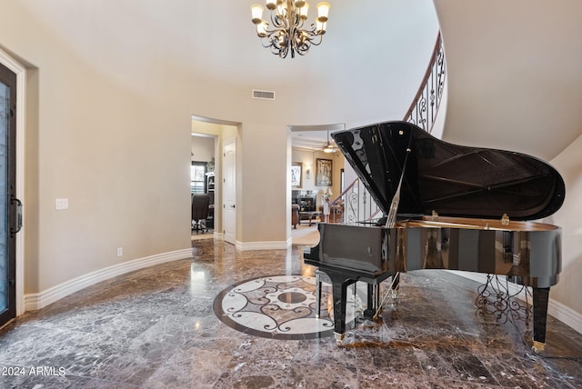 misc room featuring a notable chandelier and tile patterned floors