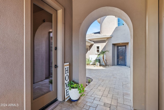 doorway to property featuring a patio area