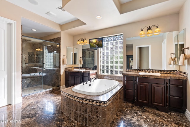 bathroom featuring plus walk in shower, tile patterned flooring, and vanity