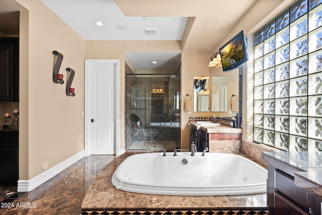 bathroom with plus walk in shower, tile patterned floors, and vanity