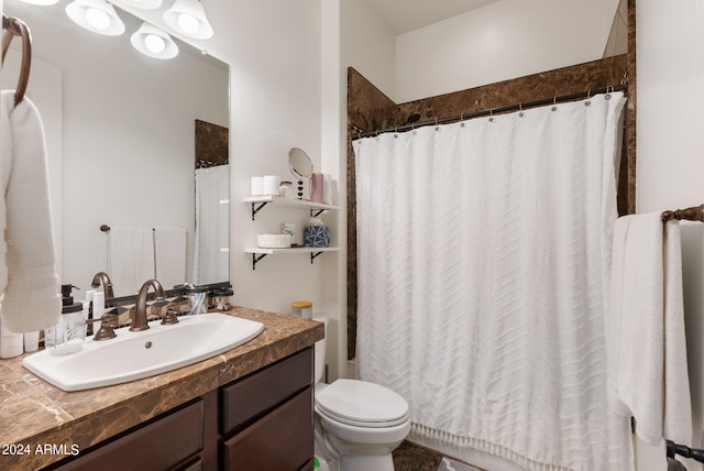 bathroom with vanity, toilet, and a shower with shower curtain