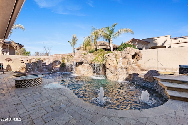 view of patio featuring a fire pit