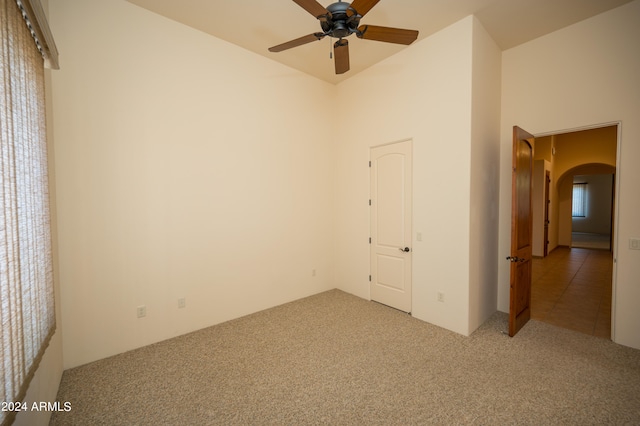 unfurnished bedroom with carpet flooring and ceiling fan