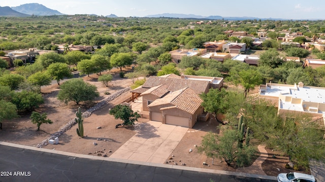 birds eye view of property featuring a mountain view