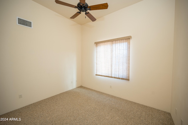 spare room featuring ceiling fan and carpet flooring