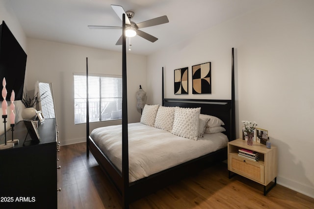 bedroom with ceiling fan and dark hardwood / wood-style floors