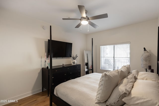 bedroom featuring ceiling fan and hardwood / wood-style flooring