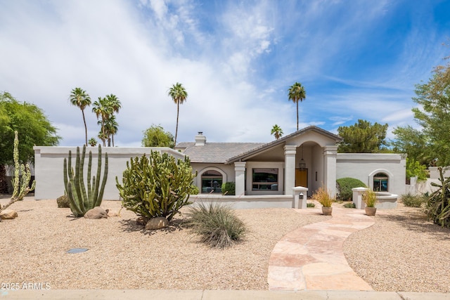 5438 E Lupine Ave, Scottsdale, AZ 85254 - view of front of home featuring stucco siding and a chimney