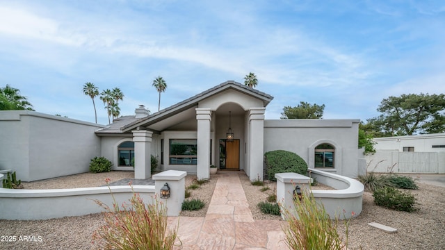5438 E Lupine Ave, Scottsdale, AZ 85254 - view of front of home featuring stucco siding and a chimney