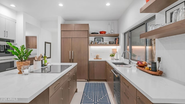 5438 E Lupine Ave, Scottsdale, AZ 85254 - kitchen featuring open shelves, appliances with stainless steel finishes, a sink, recessed lighting, and a kitchen island