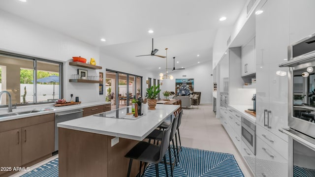 5438 E Lupine Ave, Scottsdale, AZ 85254 - kitchen featuring a center island, open shelves, a sink, appliances with stainless steel finishes, and modern cabinets