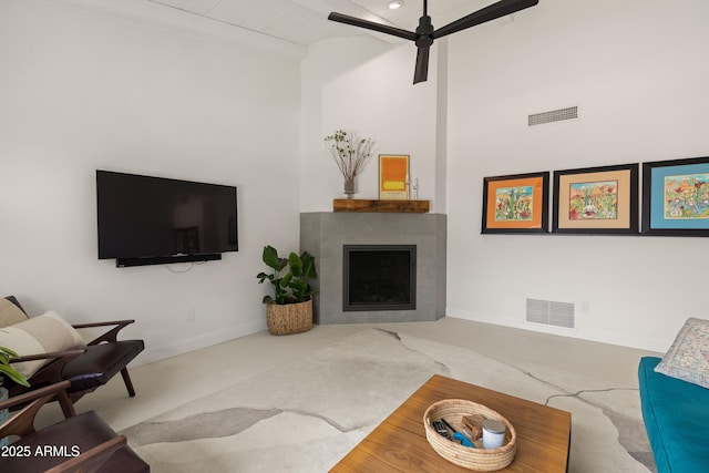 5438 E Lupine Ave, Scottsdale, AZ 85254 - carpeted living room with a fireplace, high vaulted ceiling, baseboards, and a ceiling fan