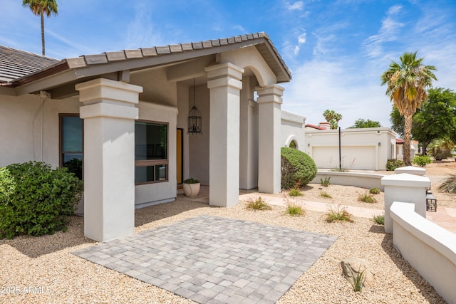 5438 E Lupine Ave, Scottsdale, AZ 85254 - view of exterior entry with stucco siding and a tiled roof