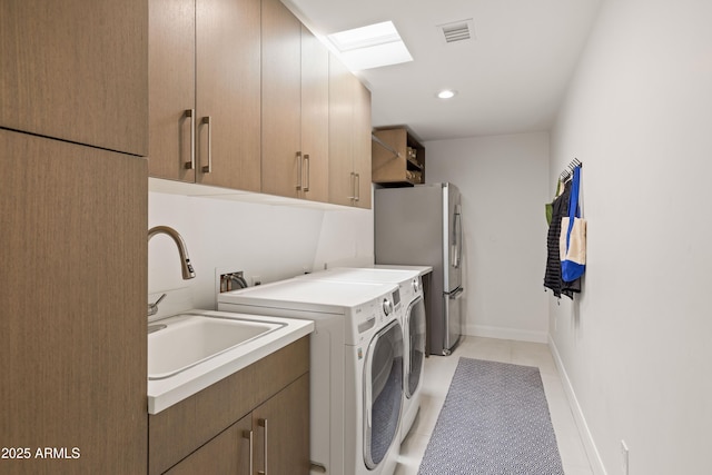 5438 E Lupine Ave, Scottsdale, AZ 85254 - washroom with washing machine and clothes dryer, light tile patterned floors, cabinet space, recessed lighting, and baseboards