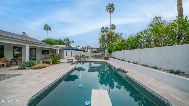5438 E Lupine Ave, Scottsdale, AZ 85254 - view of pool with a patio area, a fenced backyard, a diving board, and a pergola
