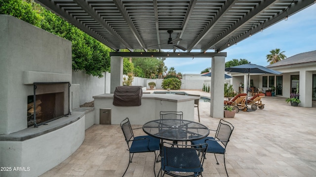 5438 E Lupine Ave, Scottsdale, AZ 85254 - fenced backyard featuring exterior fireplace, outdoor dining space, and a patio