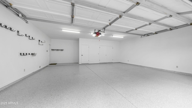 5438 E Lupine Ave, Scottsdale, AZ 85254 - garage with a garage door opener and baseboards