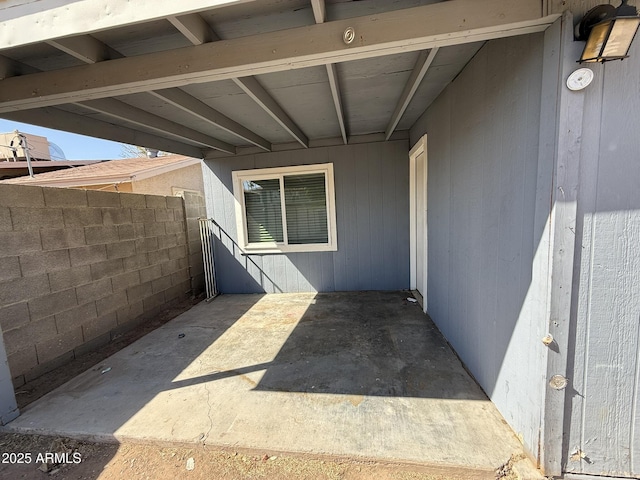 view of patio featuring fence