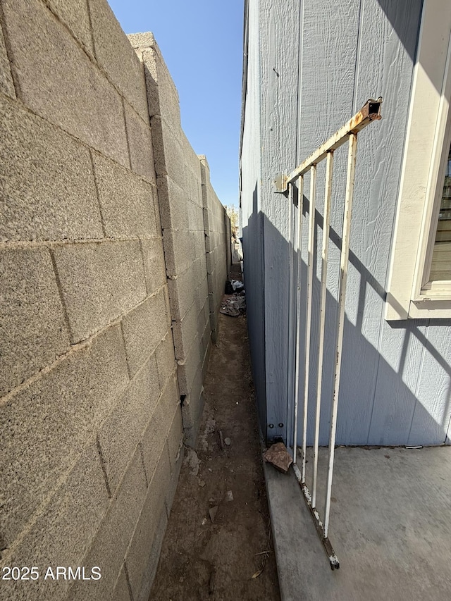 view of home's exterior with fence