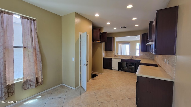 4432 W Pleasant Ln, Laveen, AZ 85339 - kitchen featuring dishwasher, light countertops, light tile patterned floors, dark brown cabinetry, and recessed lighting